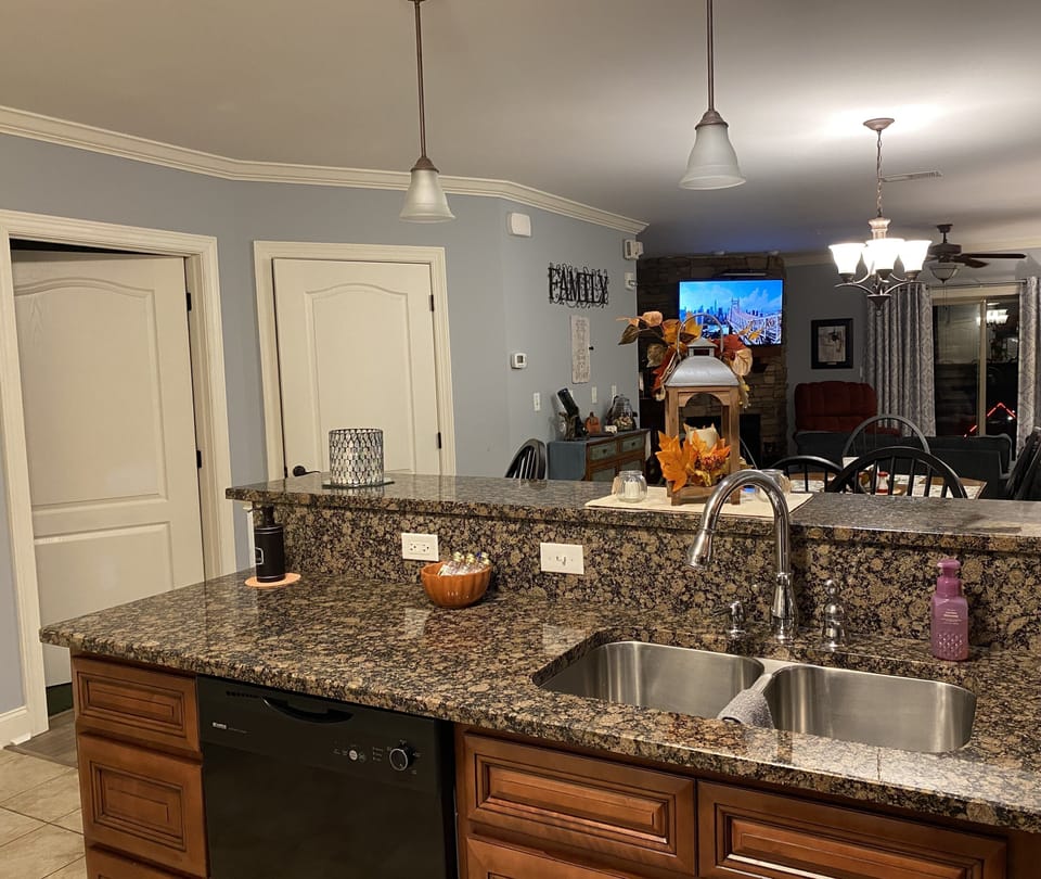Granite Counter Tops throughout the Kitchen encase Dual Deep Sink Wells