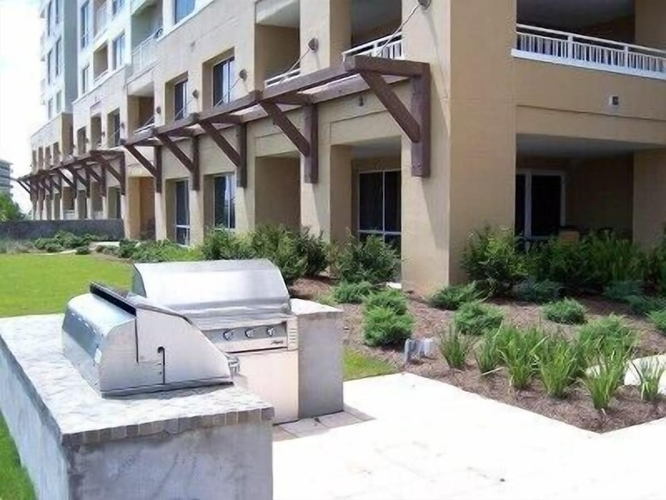 BBQ area,  patio in the background is for your unit on the 1at floor corner.

