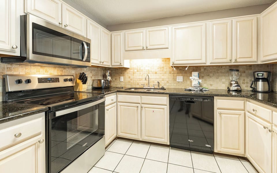 Whip up your favorite vacation meals in this inviting kitchen, complete with sleek appliances and ample counter space