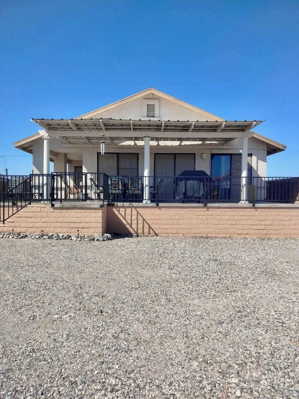 Front of home with covered patio