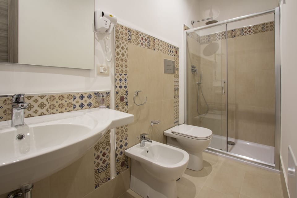 Shower, rainfall showerhead, free toiletries, hair dryer