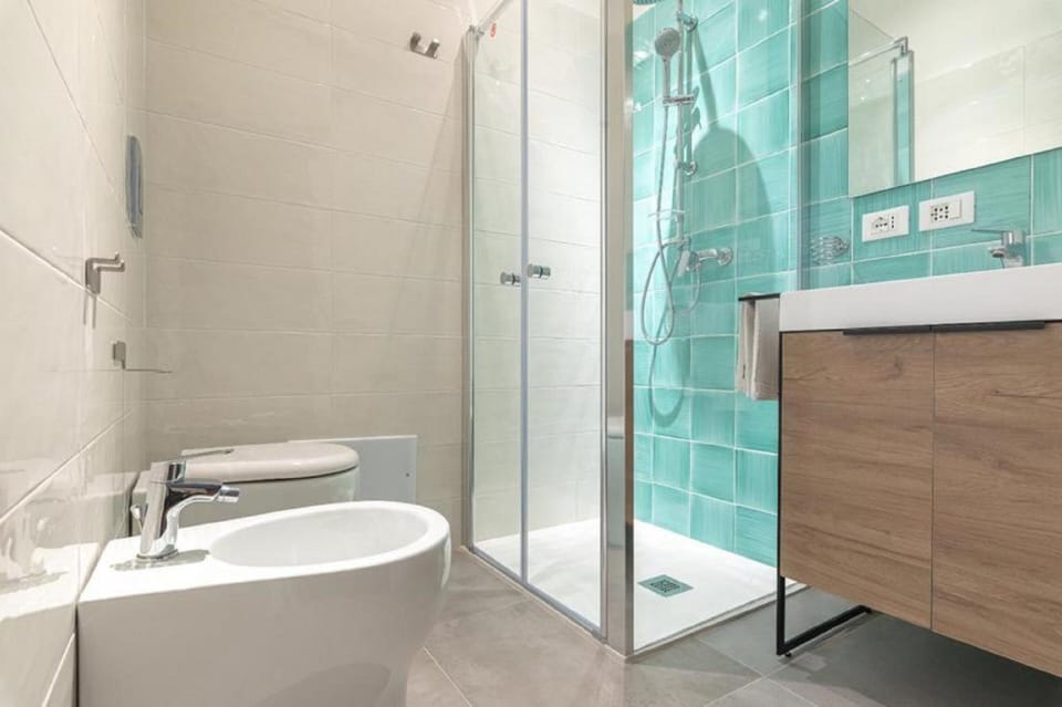 Double Room | Bathroom | Shower, hair dryer, bidet, towels