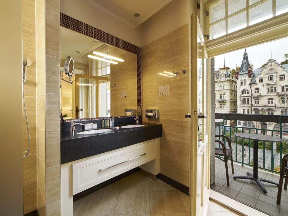 Shower, hair dryer, slippers, towels