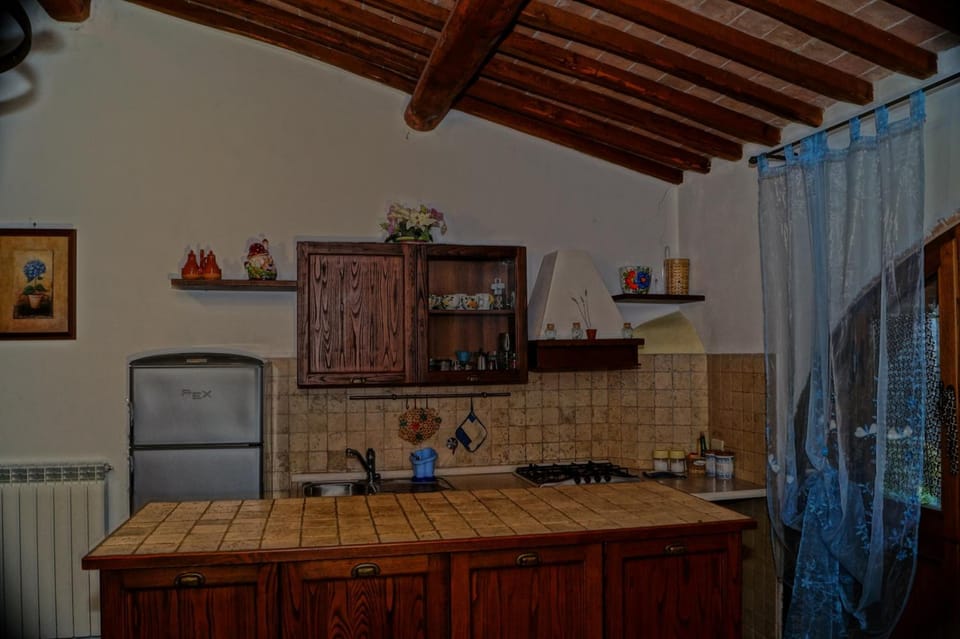 Fridge, stovetop, coffee/tea maker, cookware/dishes/utensils