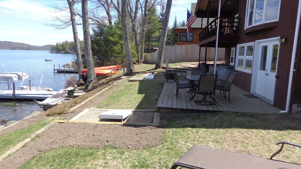 Lower deck, cornhole boards, and fire pit/pan