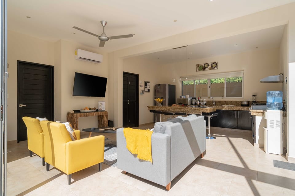 Living Room with 55" Smart TV and Pool View