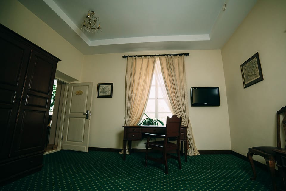 Deluxe Double Room | Living area | LCD TV