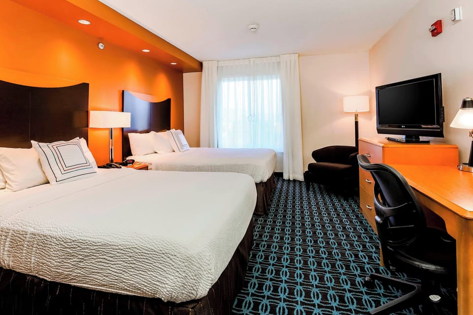 Hypo-allergenic bedding, down comforters, desk, laptop workspace