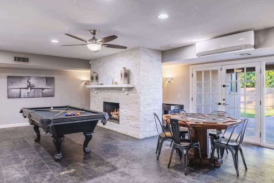 Pool table and dining space create the perfect indoor entertainment hub.