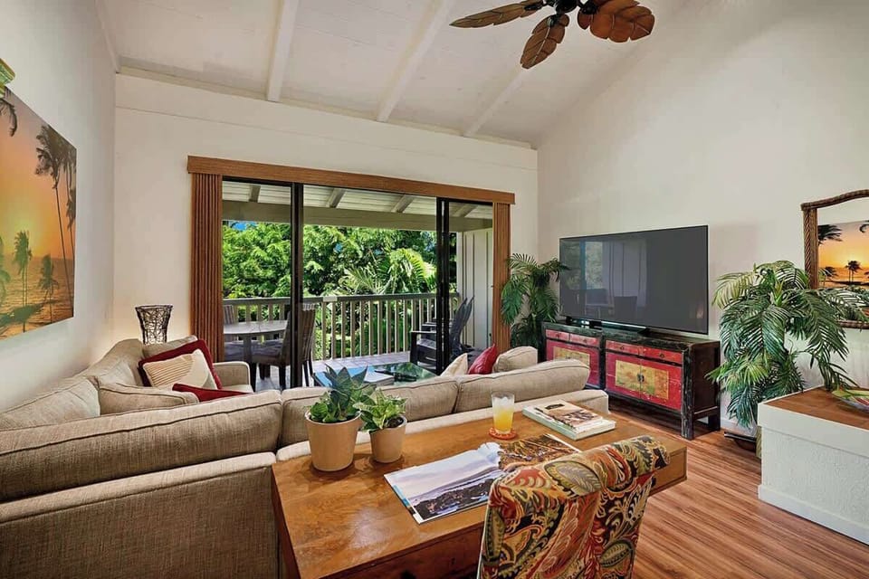 Living room features A/C, Ceiling Fans and gorgeous garden views