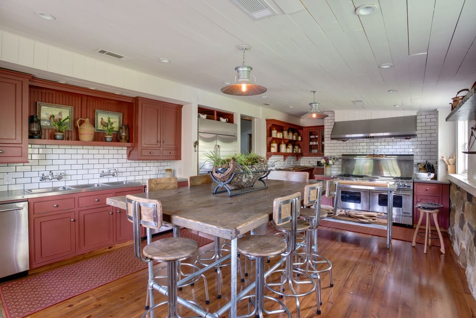 Copper and stainless gleam in the casual dining  kitchen