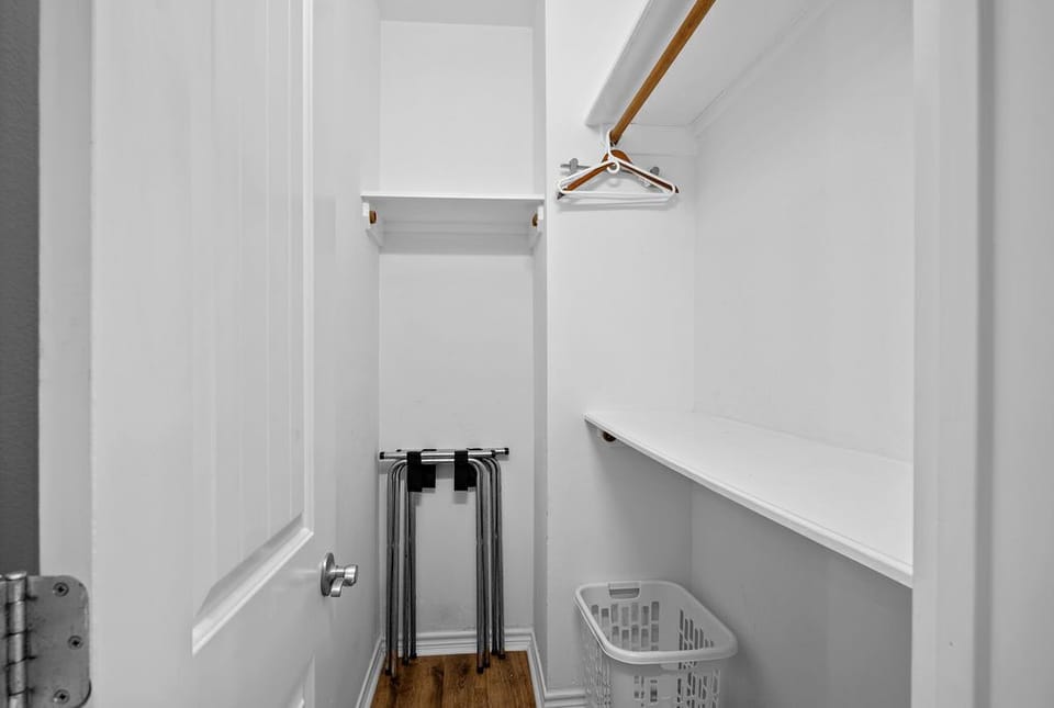Spacious closet for suitcases and personal items.