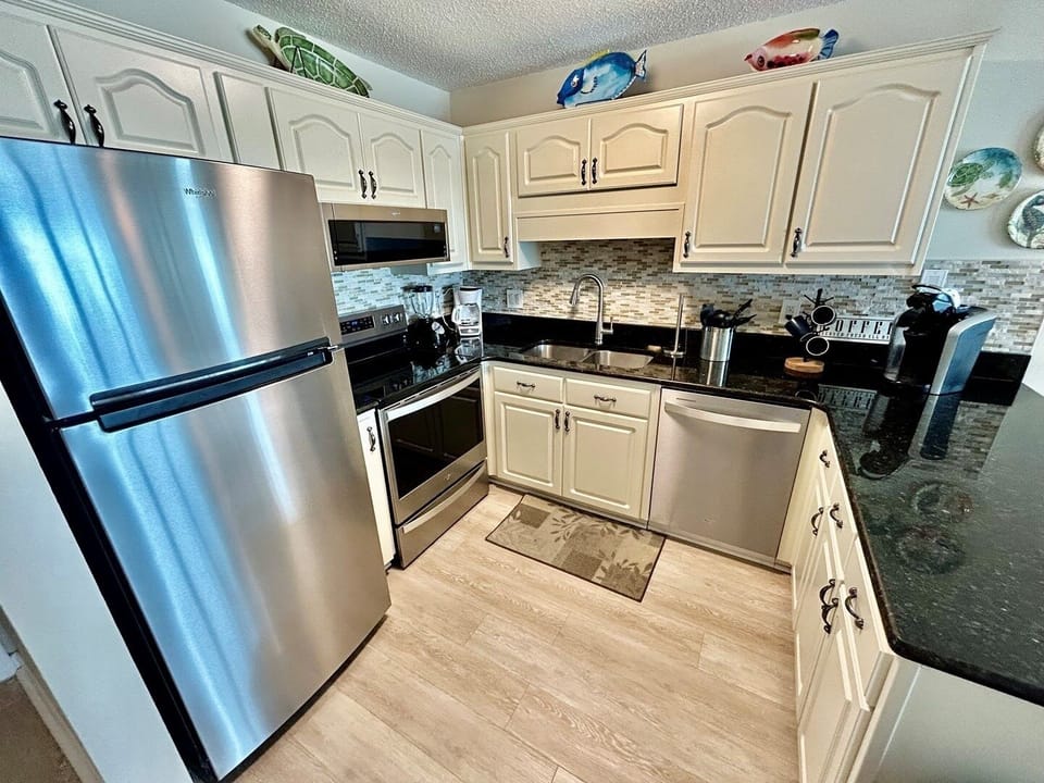 Indoors, Kitchen, Floor, Refrigerator, Microwave