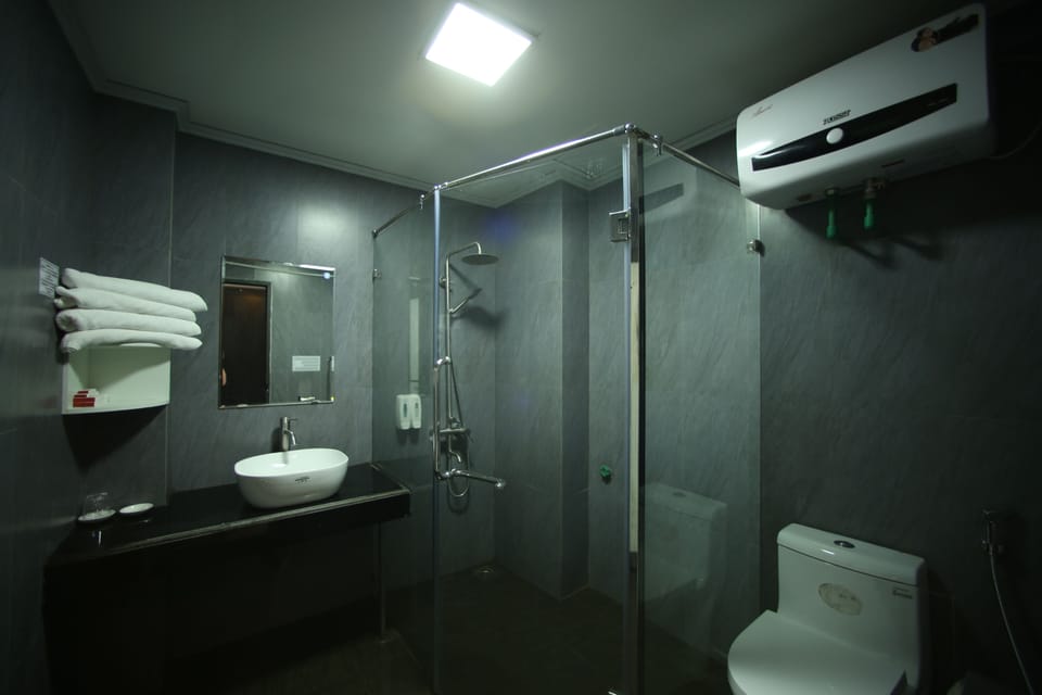 Shower, free toiletries, hair dryer, slippers