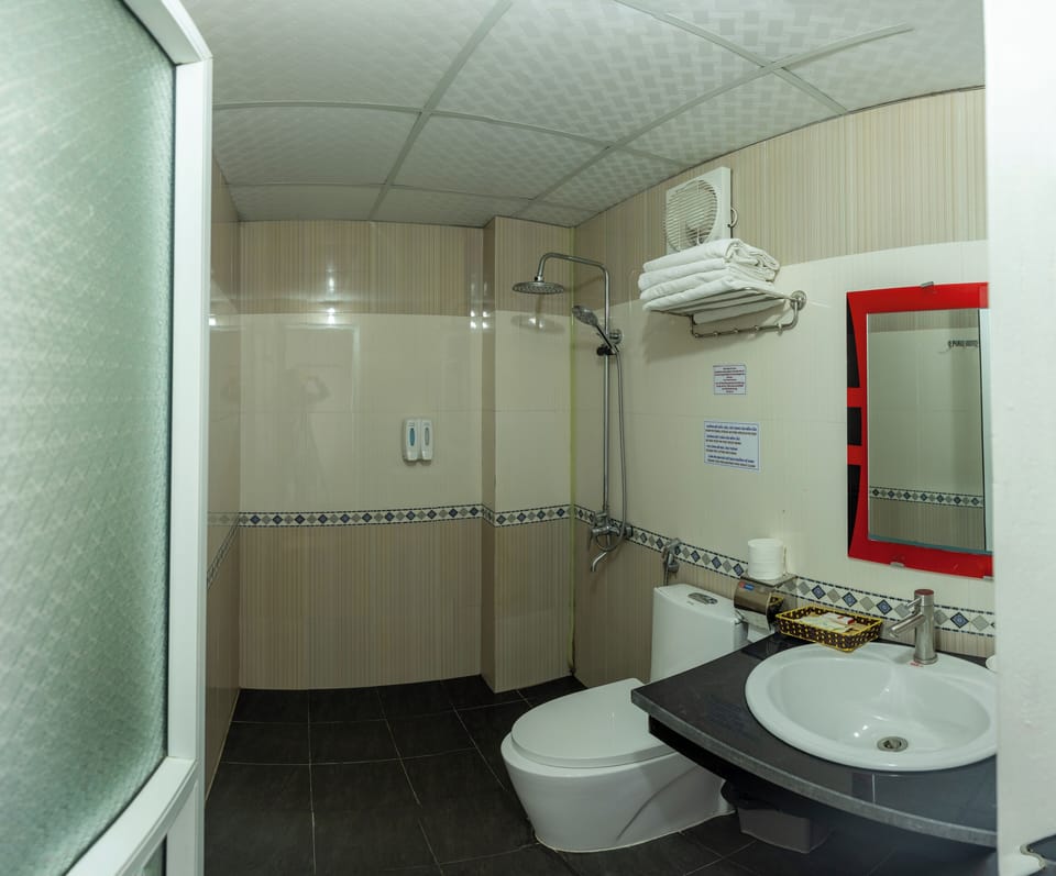 Shower, free toiletries, hair dryer, slippers