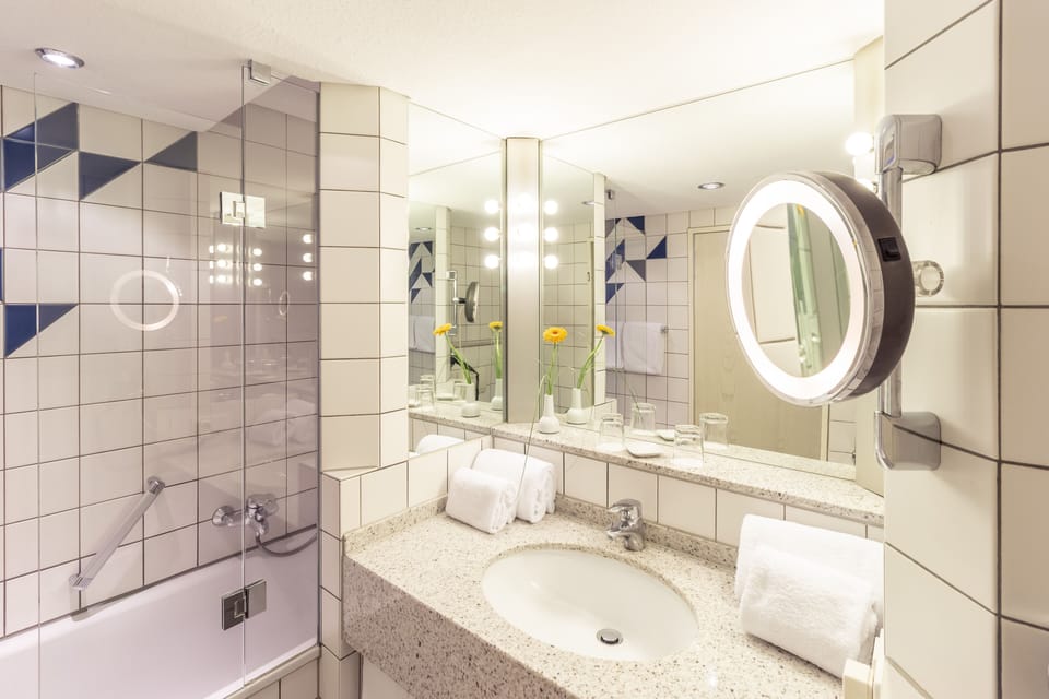 Privilege, Suite, 1 King Bed | Bathroom | Combined shower/tub, deep soaking tub, eco-friendly toiletries