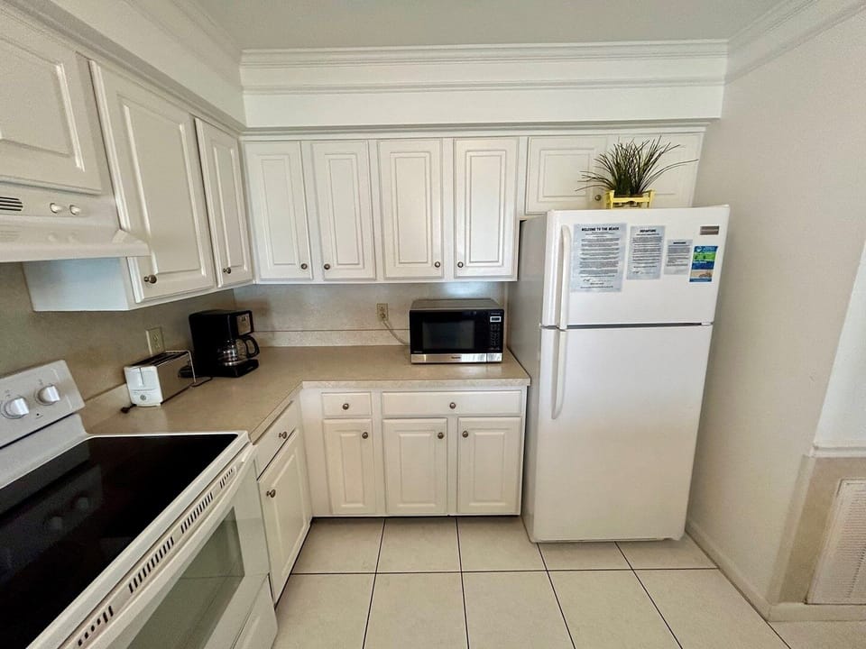 Indoors, Refrigerator, Kitchen, Floor, Microwave