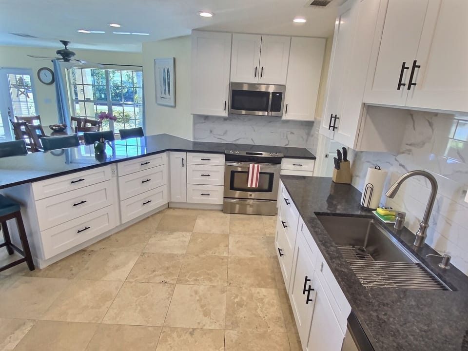 Bright modern kitchen with plenty of room for multiple people to enjoy