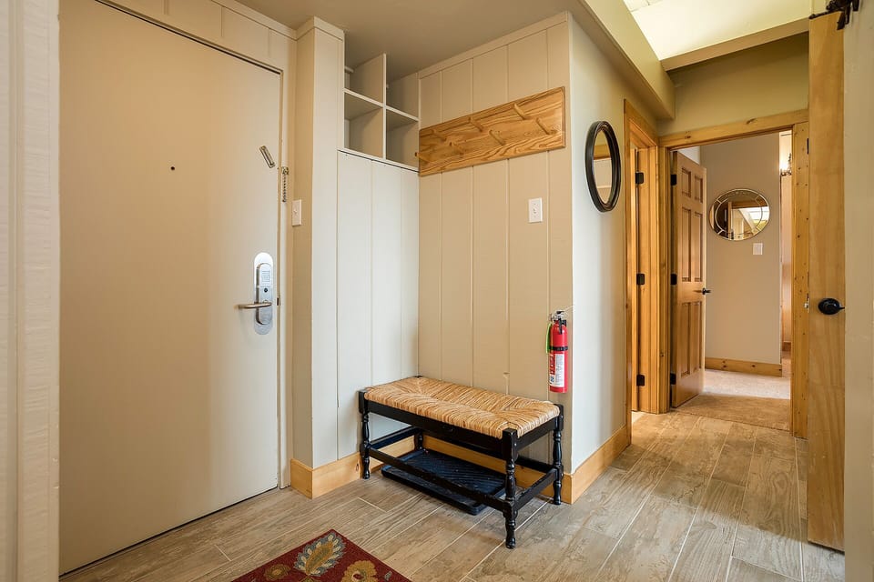 Step into your welcoming entryway with custom built-in storage and rustic bench—perfect for organizing gear after mountain adventures.