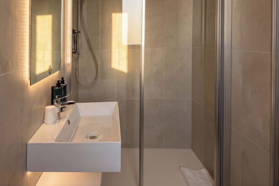 Shower, free toiletries, hair dryer, towels