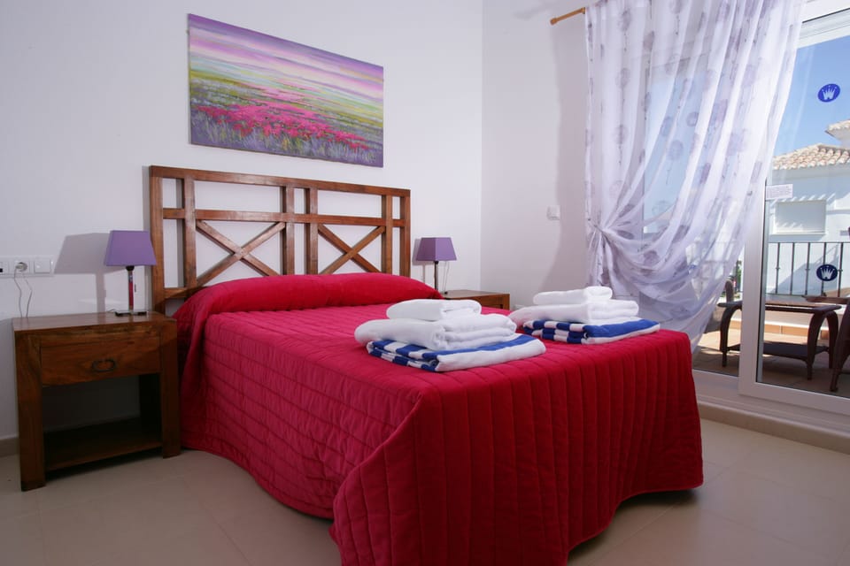 Master bedroom with front and rear balcony/sunbathing area and private en suit