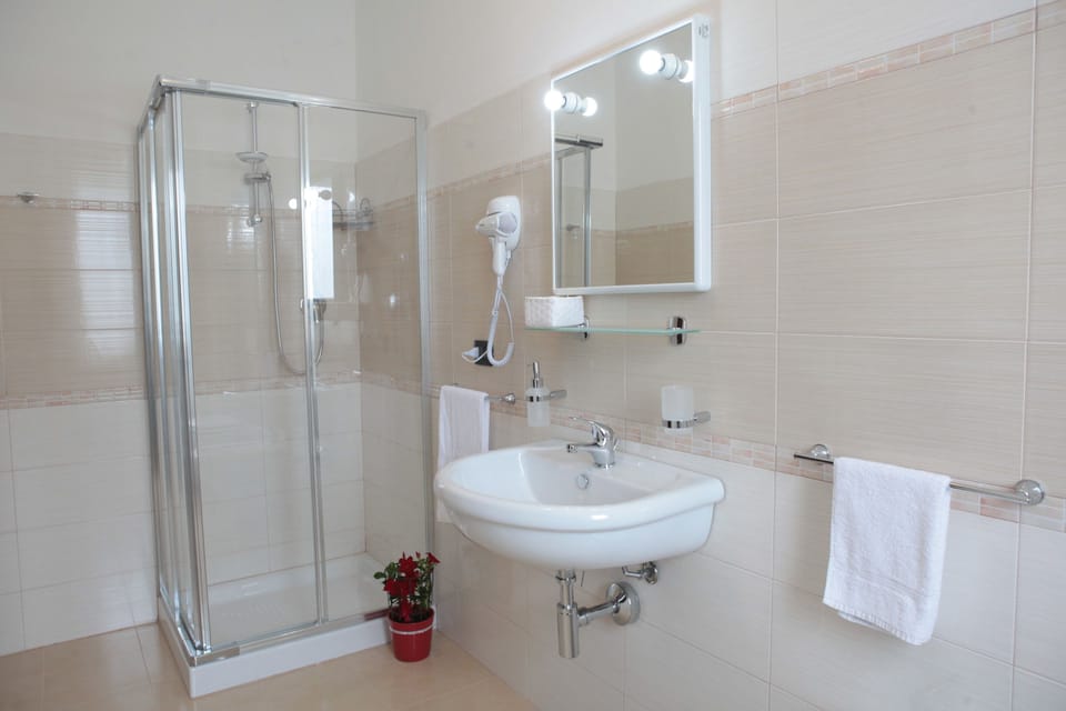 Quadruple Room, Sea View | Bathroom | Shower, free toiletries, hair dryer, bidet