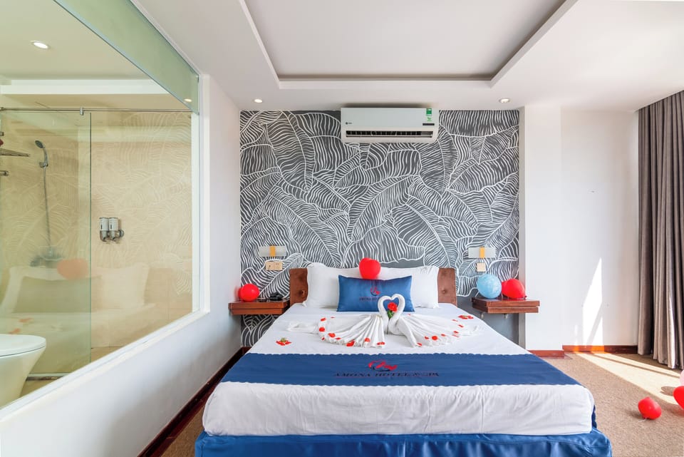 Deluxe Room, 1 Queen Bed, City View | 1 bedroom, desk, blackout drapes, free WiFi