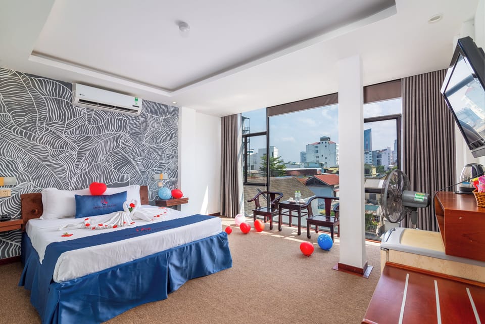Deluxe Room, 1 Queen Bed, City View | 1 bedroom, desk, blackout drapes, free WiFi