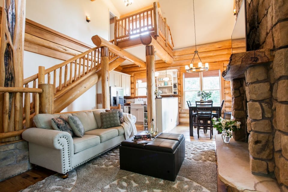 Living room with flat-screen TV and gas logs fireplace.