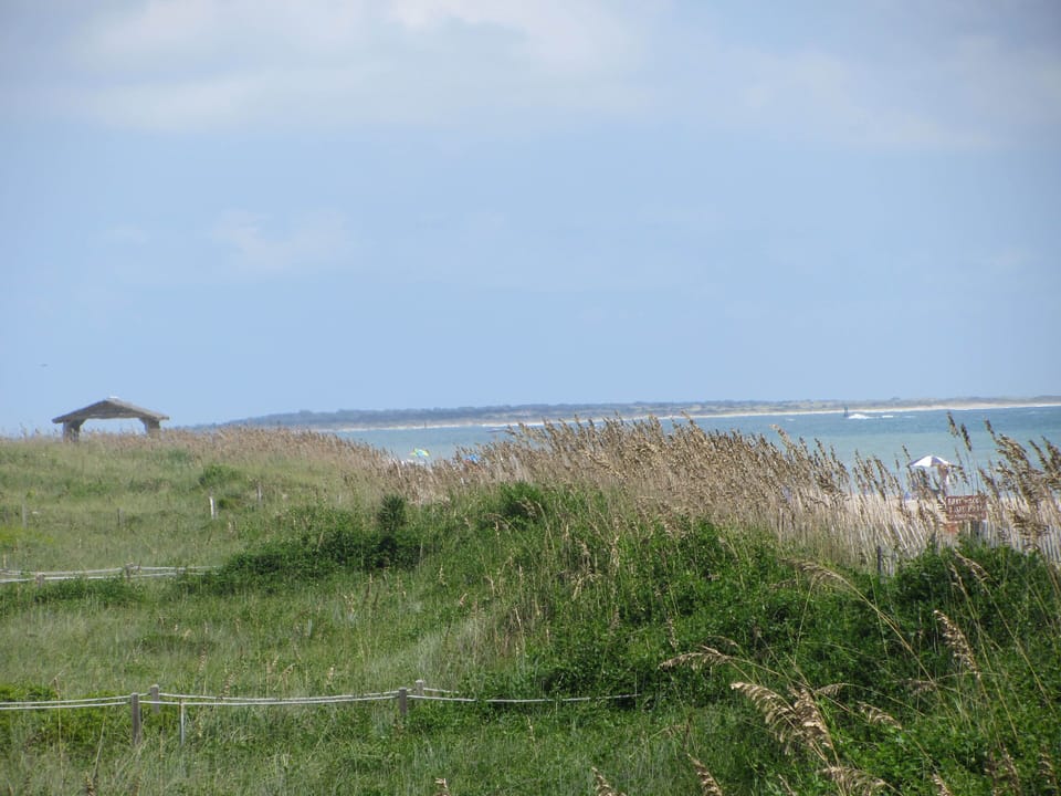 View to the left: Fort Macon bath houses, Beaufort Inlet, and Shackleford Banks