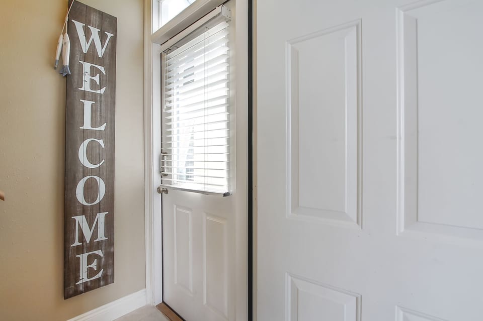 Main front door that leads to upstairs