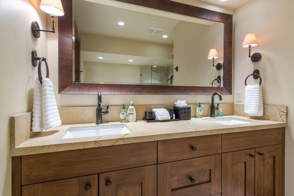 His and hers sinks with soaps, towels, and more amenities for guests. 
