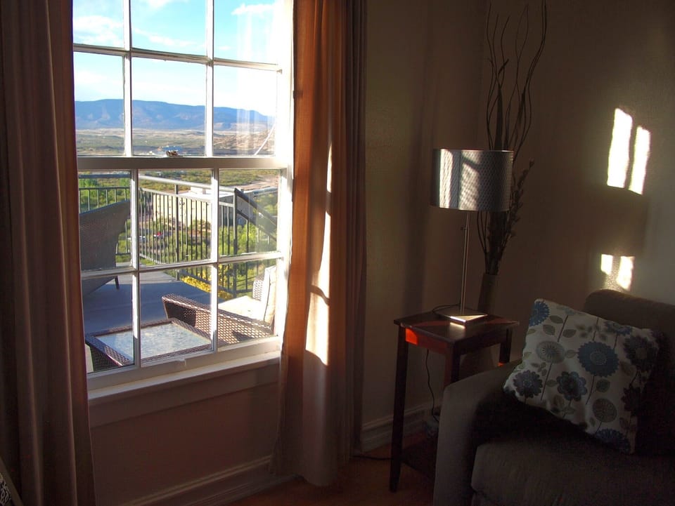 Living room in 208 looking out onto the shared deck.