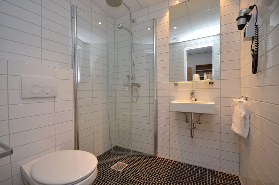 Double Room | Bathroom | Hair dryer, heated floors, towels, soap