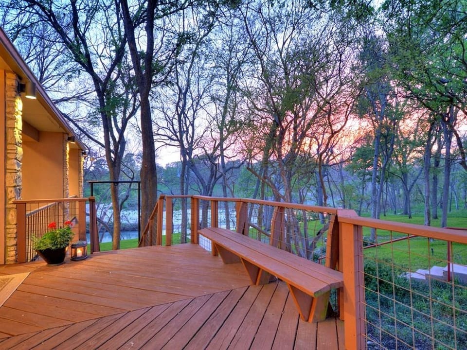 Deck off the kitchen area with a gas grill. 