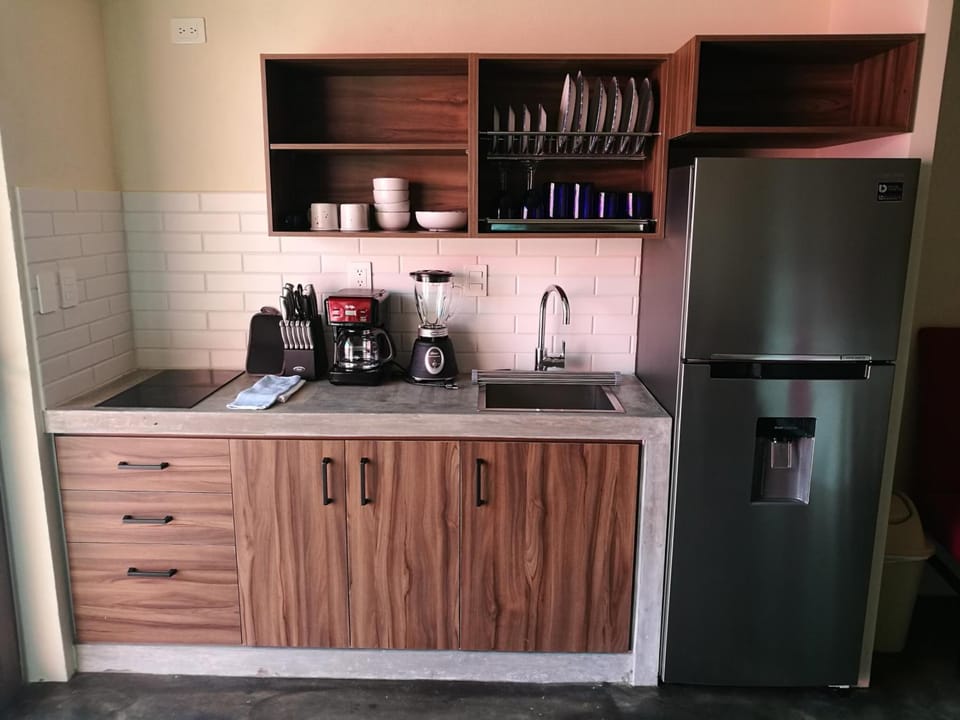 Full-size fridge, coffee/tea maker, cookware/dishes/utensils