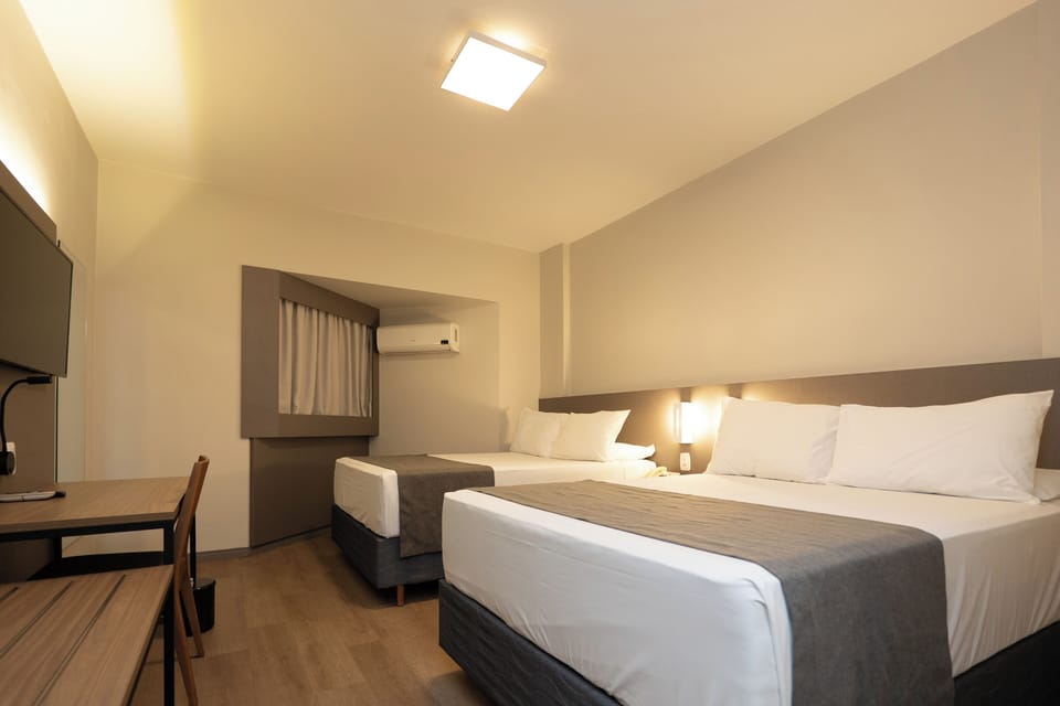 Deluxe Quadruple Room, Multiple Bedrooms | Minibar, desk, blackout drapes, iron/ironing board