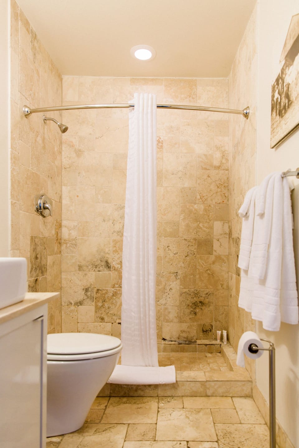 Combined shower/tub, designer toiletries, hair dryer, towels