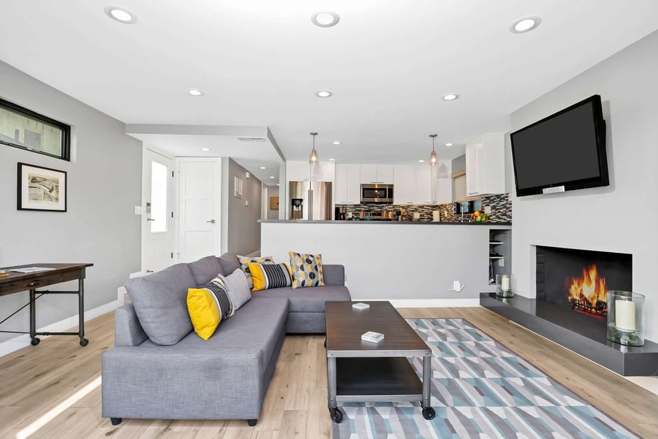 The living room is the central point, providing access to both the kitchen and the patio area.  It helps bring everyone together for a great time.