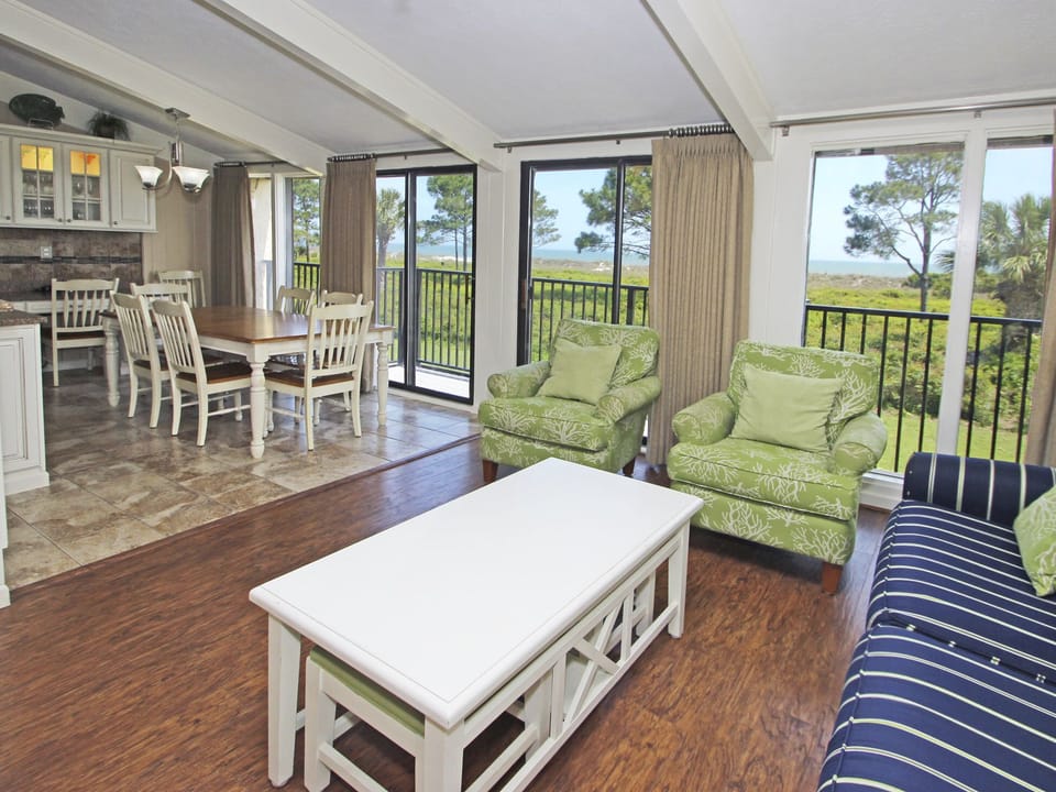 Dining room/living area with a direct oceanfront beautiful view. Seating for 8.