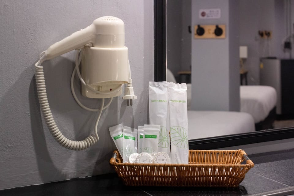 Family Quad Room No Window | Bathroom amenities | Shower, free toiletries, hair dryer, slippers