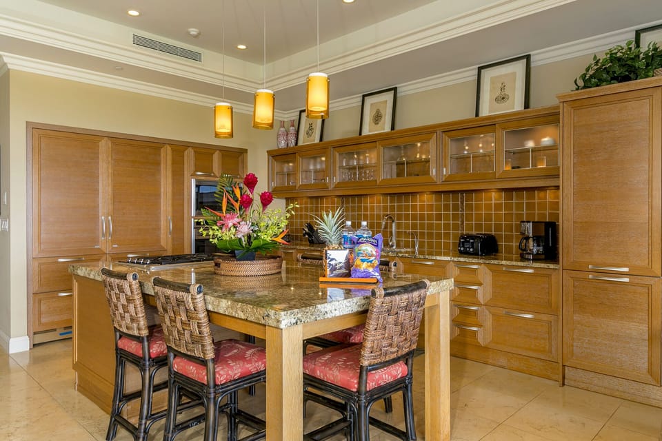 Gourmet kitchen with two SubZero refrigerators and professional appliances