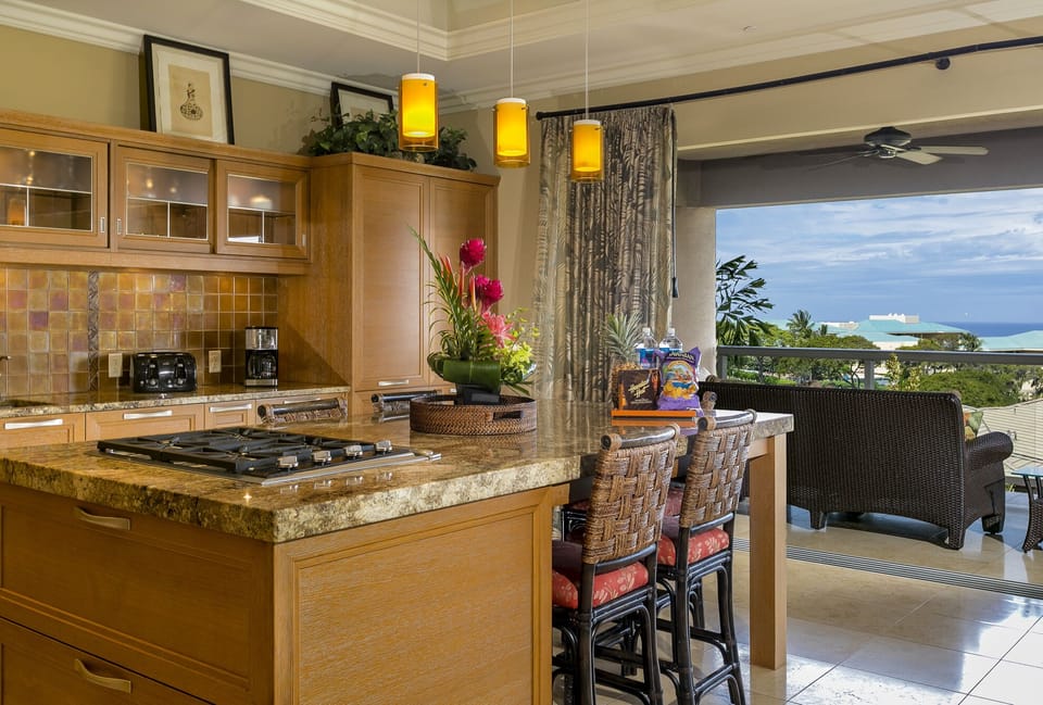 Gourmet kitchen with dining island, seating for six and spectacular ocean views