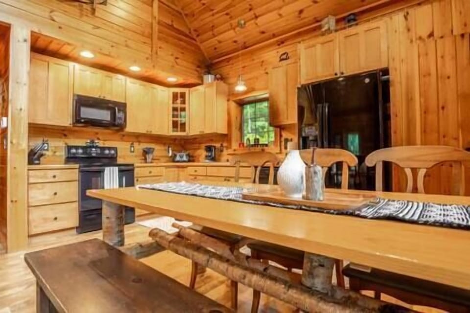 Full kitchen with coffee pot, slow cooker, utensils, pots/pans, waffle iron