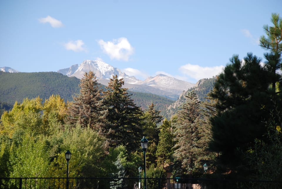 Riverside Cottage is in the trees on right side of Photo. Longs Peak in Bkgd.