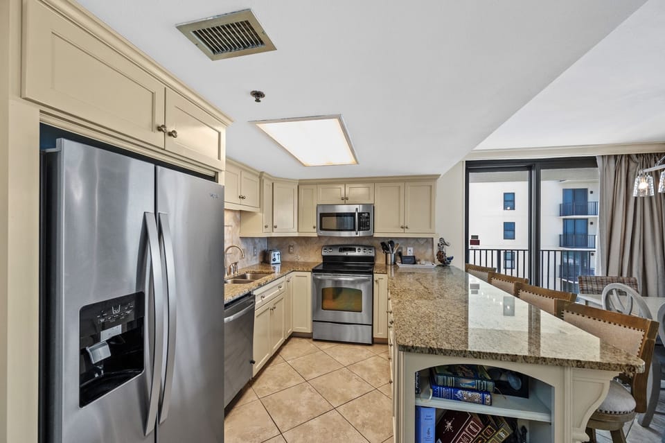 Spacious Kitchen with Stainless Steel Appliances, Granite Counter Tops and Fantastic Views