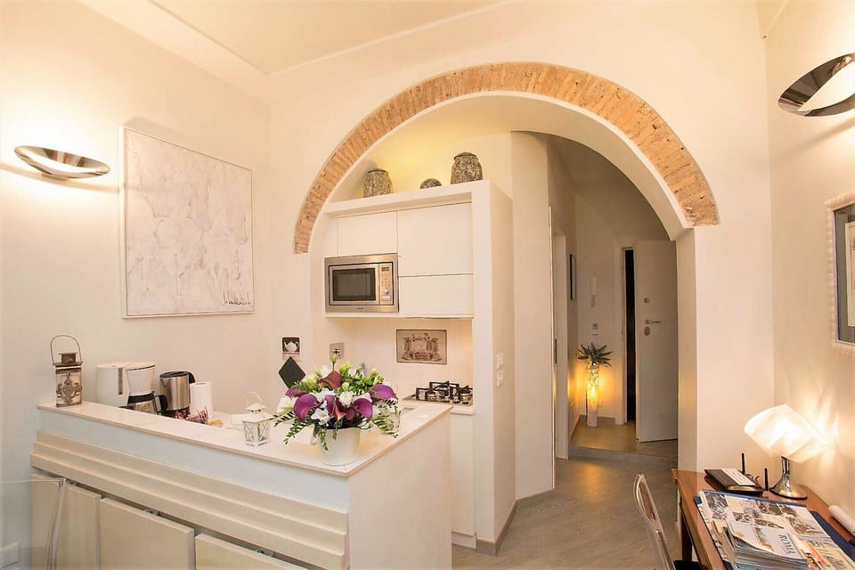 View of the kitchen and of the entrance.