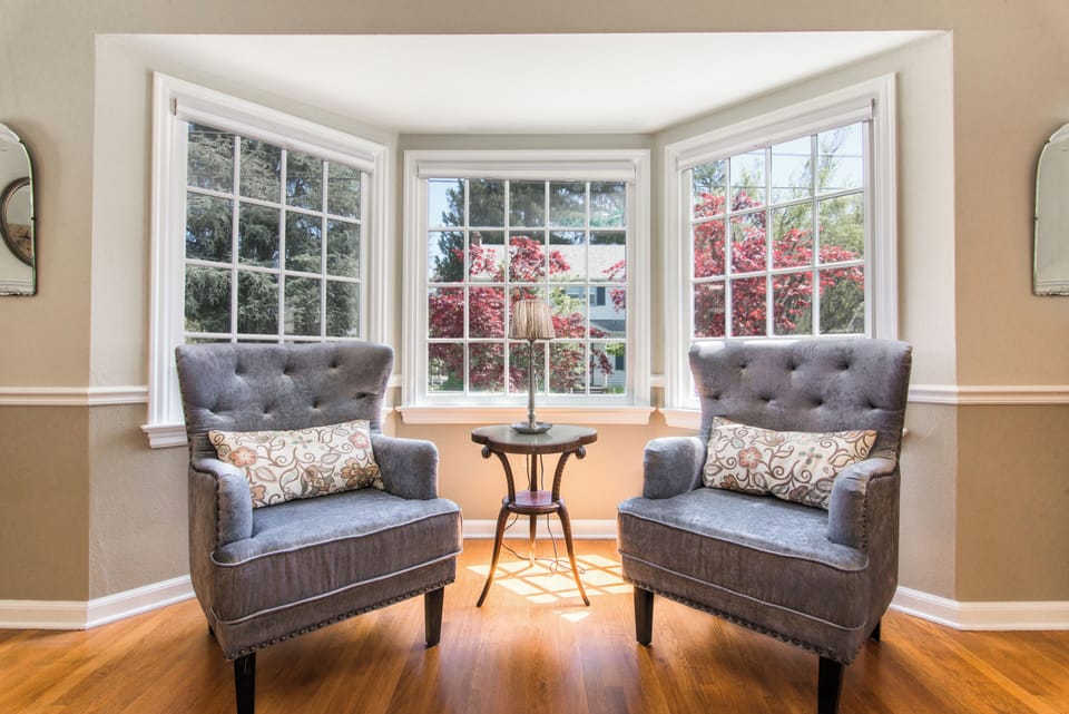 Living Room Bay Window | Original Hardwood Floors | Dog Friendly