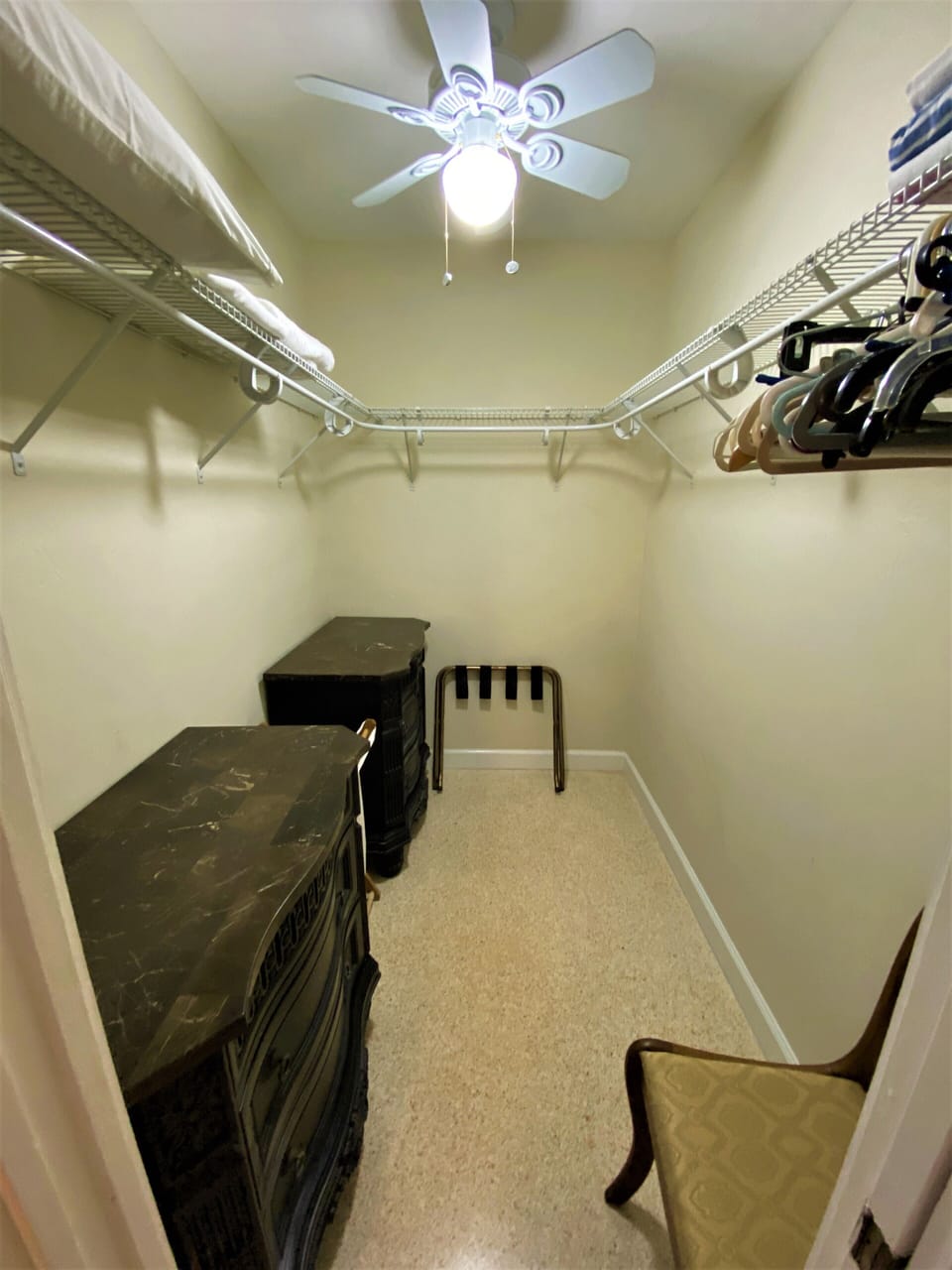 Master bedroom closet with pillow , bed sheets and beach towels