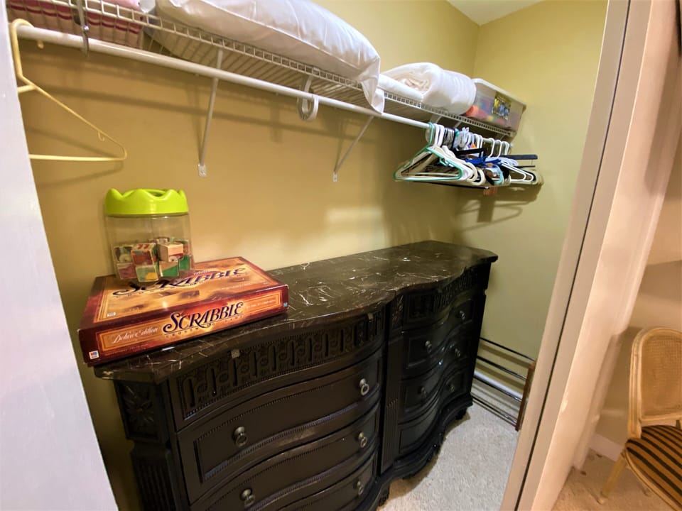 Third bedroom closet with extra pillow ,bed sheets  and beach towels